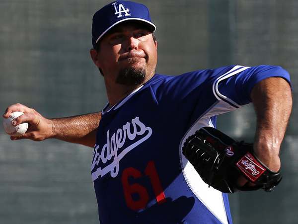 Josh Beckett saw his 2013 cut short by thoracic outlet syndrome in his shoulder. (Paul Sancya/AP)